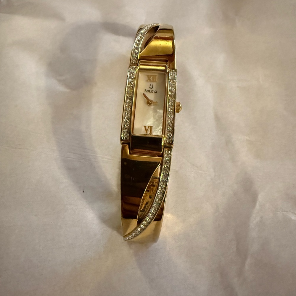 Bulova designer brand. Beautiful Watch with crystal accents. Needs battery